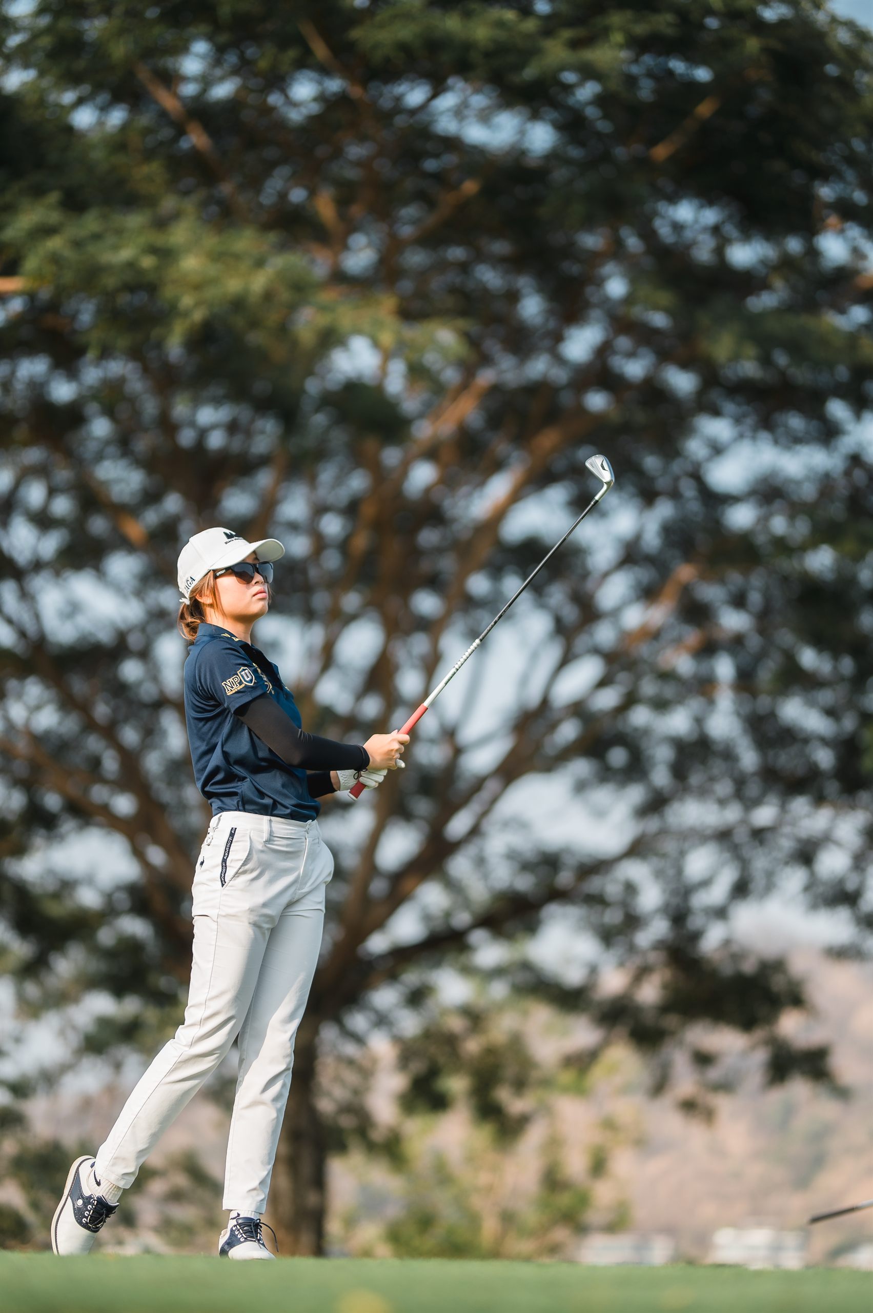 JAGA student-athlete watching her shot
