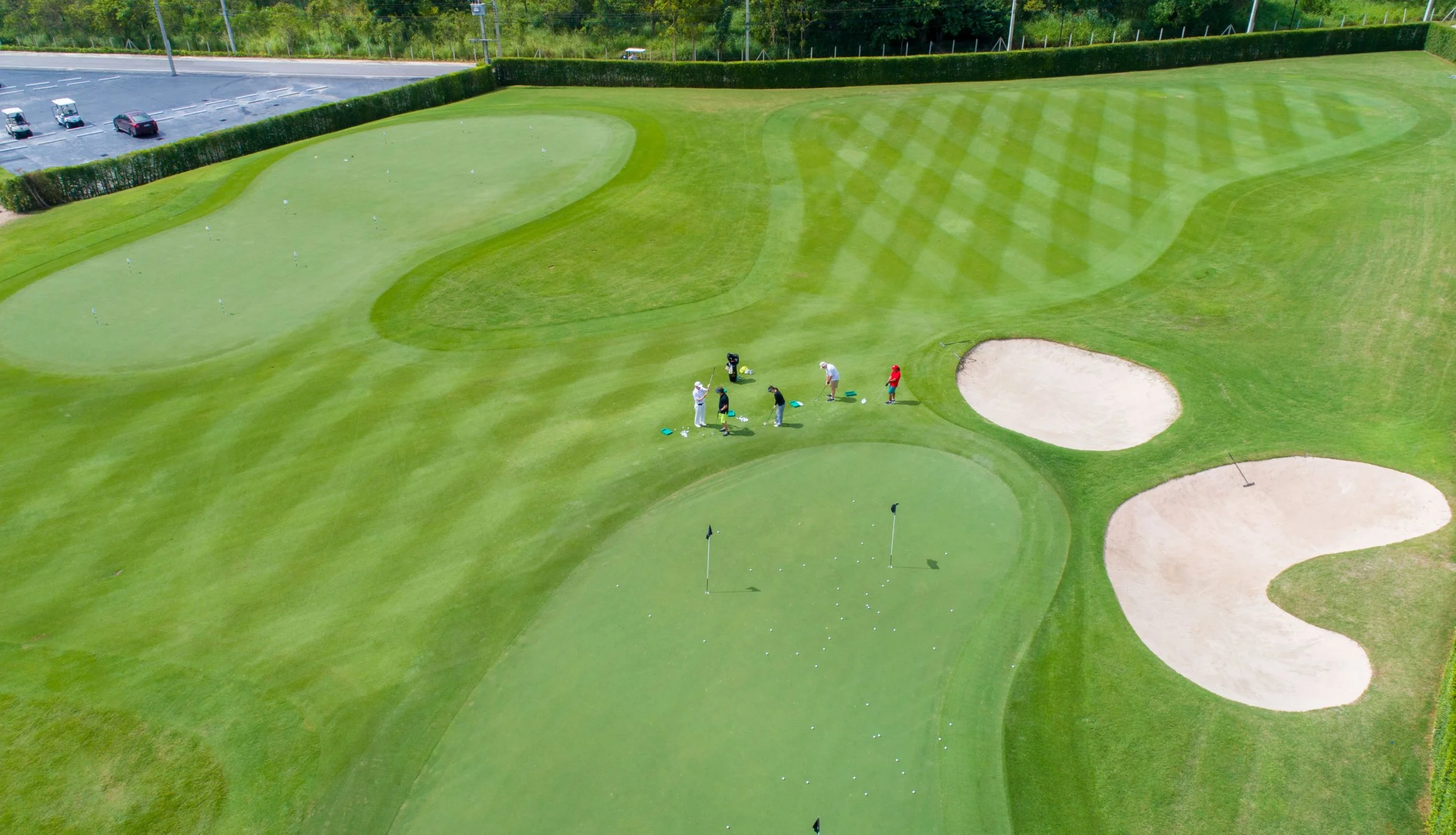 JAGA student-athletes on the short-game practice area